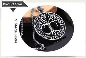 Macro detail of antique silver tree of life pendant with woven edges on a wood base