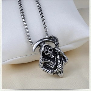 Detailed close-up of a stainless steel Grim Reaper skull pendant with a bead chain