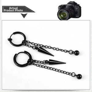 Detail view of black stainless steel hoop earrings with hanging tassel chains and cone charms