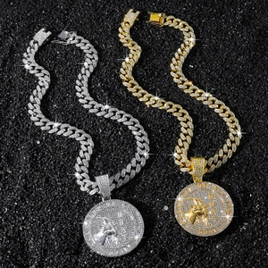 Iced out Cuban link chain set with golden and silver goat head pendants in hip hop style