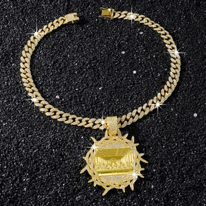 Close-up of hip-hop gold chain with Last Supper pendant and paved crystal rhinestones
