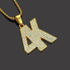 Iced out gold K letter pendant necklace with sparkling rhinestones for men