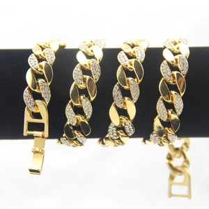 Detailed view of 18K gold plated Cuban link chain with paved white zircons and folding clasp