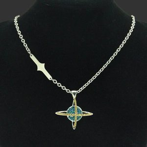Macro view of planet pendant necklace featuring blue and yellow crystal rhinestones