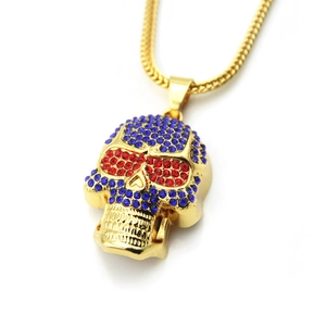 Detailed view of hip hop skull pendant featuring blue crystals and red rhinestone eyes