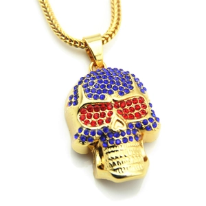 Macro shot of hip hop skull pendant with blue rhinestones and red crystal eyes