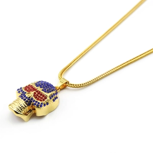 Hip hop skull pendant necklace in gold finish with blue rhinestones and red eye accents