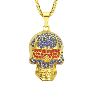 Golden hip hop skull pendant necklace with blue crystals and red rhinestone eyes
