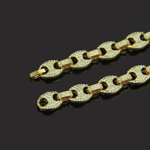 Men's hip hop gold coffee bean chain necklace with iced out rhinestones on black background