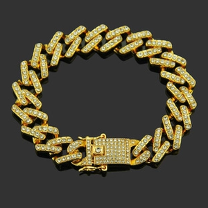 Detailed view of the gold-plated Cuban chain link bracelet with sparkling pave rhinestones