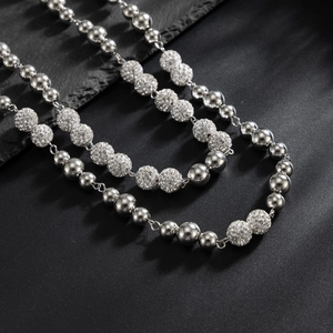 Polished silver pearl and pave crystal ball hip-hop trouser chain for men on grey stone