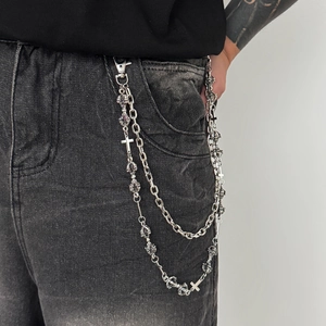 Men's silver multi-layer metal wallet chain with crosses on gray denim jeans