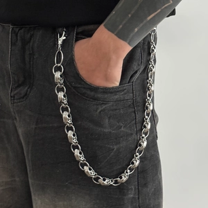 Hip hop skull trouser chain in silver metal finish hanging on denim jeans