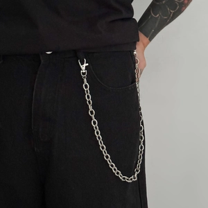 Men's silver O-chain trouser chain with spring hooks on black jeans, stylish jewelry accessory