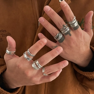 Close-up of a 12-piece vintage silver ring set featuring feather and wing designs