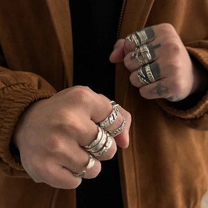 Vintage silver feather ring set for men featuring intricate carvings in punk style