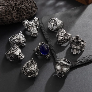 9-piece set of men's vintage lion and tiger head rings in punk gothic style with blue gem