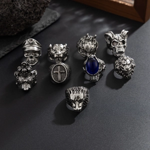 Macro detail of nine-piece retro silver punk ring set featuring lion and skull motifs