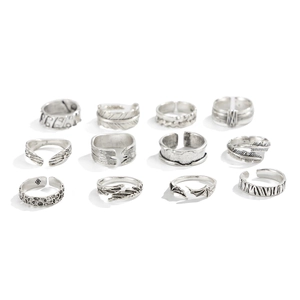 12-piece vintage silver feather ring set with gothic patterns on white background