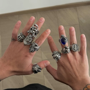 9-piece men's vintage gothic ring set featuring lion, skull, and blue gemstone designs