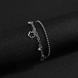 Modern double-layer stainless steel bracelet with hollow flower and bead charms