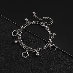 Double-layered silver stainless steel bracelet with hollow flower charms on black leather