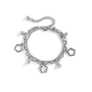 Double-layer stainless steel bracelet featuring hollow flower charms and small metal beads