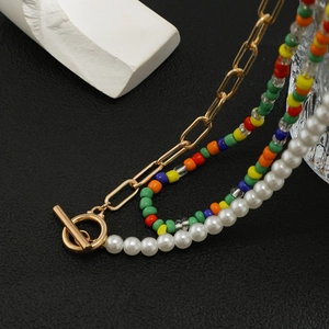 Three-layer men's necklace with colorful beads, white pearls, and golden paperclip links