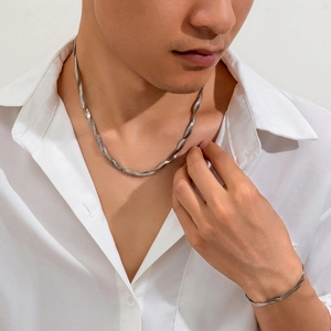 Close-up of men wearing silver twisted snake chain necklace and bracelet set