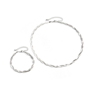 Detail of silver twisted snake chain necklace and bracelet set with adjustable tail links
