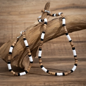 Bohemian set with wood bead necklace and bracelet on natural branch display