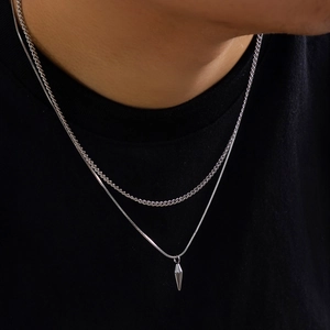 Men's double-layered silver cuban link chain set with a minimalist spike pendant charm