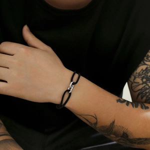 Men's minimalist black Milan rope bracelet with silver interlocking buckle closure