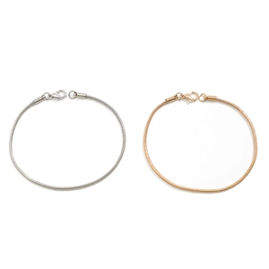 Sleek gold and silver snake bone chain bracelet set with secure lobster clasps