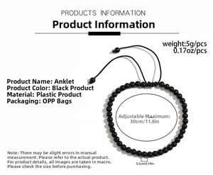 Detail showing adjustable black beaded anklet with 30cm circumference and 0.5cm bead size