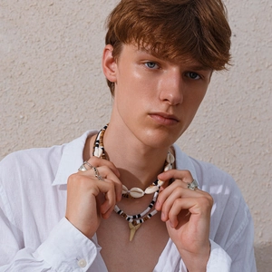 Men's layered necklace set with shell beads and shark tooth pendant with metal rings