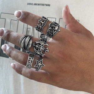 6-piece men's punk ring set featuring skull, crown and gothic feather designs in vintage silver