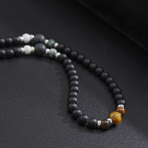 Handmade natural stone beaded necklace with matte black beads and tiger eye accents