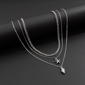 Set de colliers superposés argentés pour homme avec pendentifs étoile de mer et coquillage