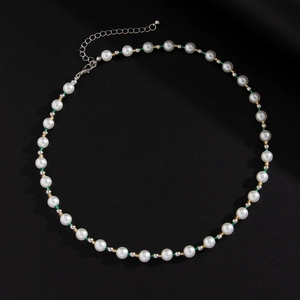 Close-up of pearl necklace with green beads and adjustable silver lobster clasp