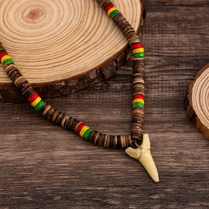 Tribal shark tooth pendant necklace with multicolored wood beads and coconut shells