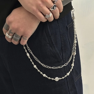 Double-layered hip hop pant chain with silver rings and faux pearls on denim jeans