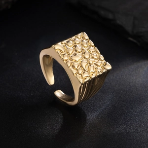 Detailed view of square men's ring with hammered metal texture and adjustable band