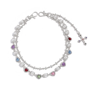 Detail of multi-layered pearl chain with colorful heart gems and a rhinestone cross pendant