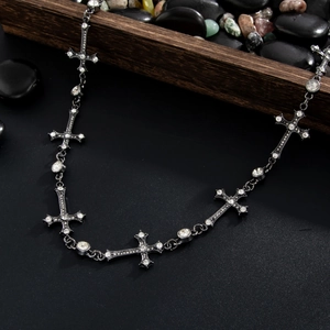 Detail of gothic hip-hop pant chain with rhinestone crosses and crystal accents