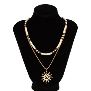 Layered men's necklace featuring wood beads, coconut shells, and a gold sun pendant