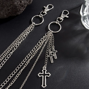 Close-up of hip-hop silver multi-layer waist chain with cross pendants and lobster clasps