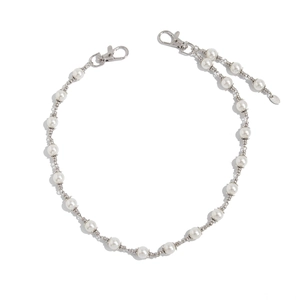 Men's pearl trouser chain with silver lobster clasps and metal floral spacers on white background