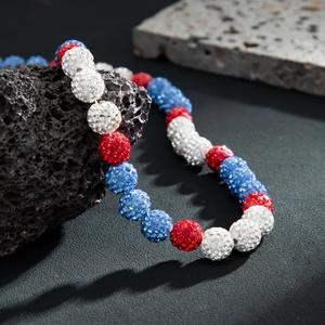 Men's trendy necklace with red white and blue rhinestone studded clay beads on rock