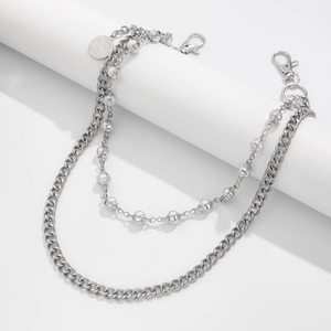 Close-up of double-layer silver hip-hop pants chain with pearls and Good Luck charm